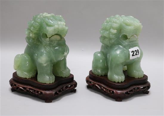 A pair of Chinese green stone lion dogs 15.5cm